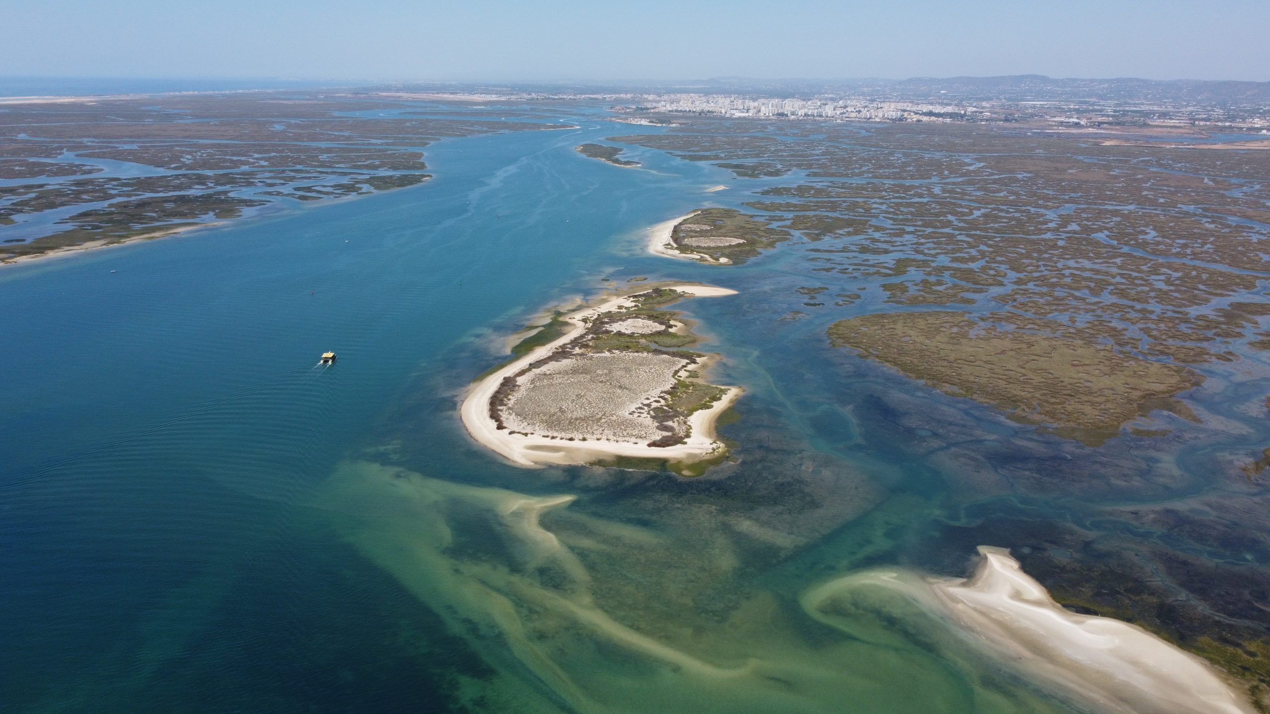 Aerial view of a coastal landscape with islands and marshes.